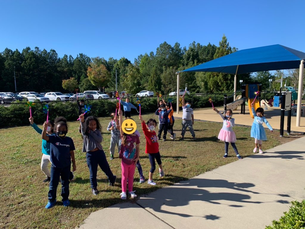 Check out these scientists in action today! Experimenting to see if the wind uses push or pull to spin our pinwheels 🤔💨 #ForceAndMotion