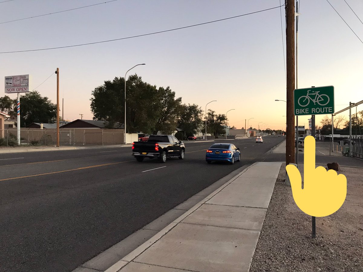 Sometimes I wonder how city planners and engineers can put up signs like this and declare victory with a straight face . This is Edith blvd in Albuquerque, a designated bike route.