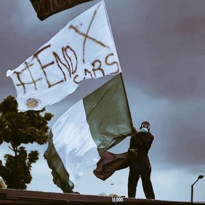 dyepkazah's tweet photo. One of the iconic pictures from #EndSARS 
#EndSARSMemorial @theflagboii https://t.co/p252oNDefH