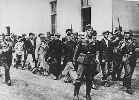 ChirpyRoe's tweet photo. 20/10/1941 In reprisal for partisan attacks Germans executed 2,324 Serbian men and boys in the Yugoslavian town of Kragujevac, including 300 boys who were herded out of the First Boys High School the previous day. Photo of a group being escorted to their execution. #LestWrForget https://t.co/grkm0KUuFx
