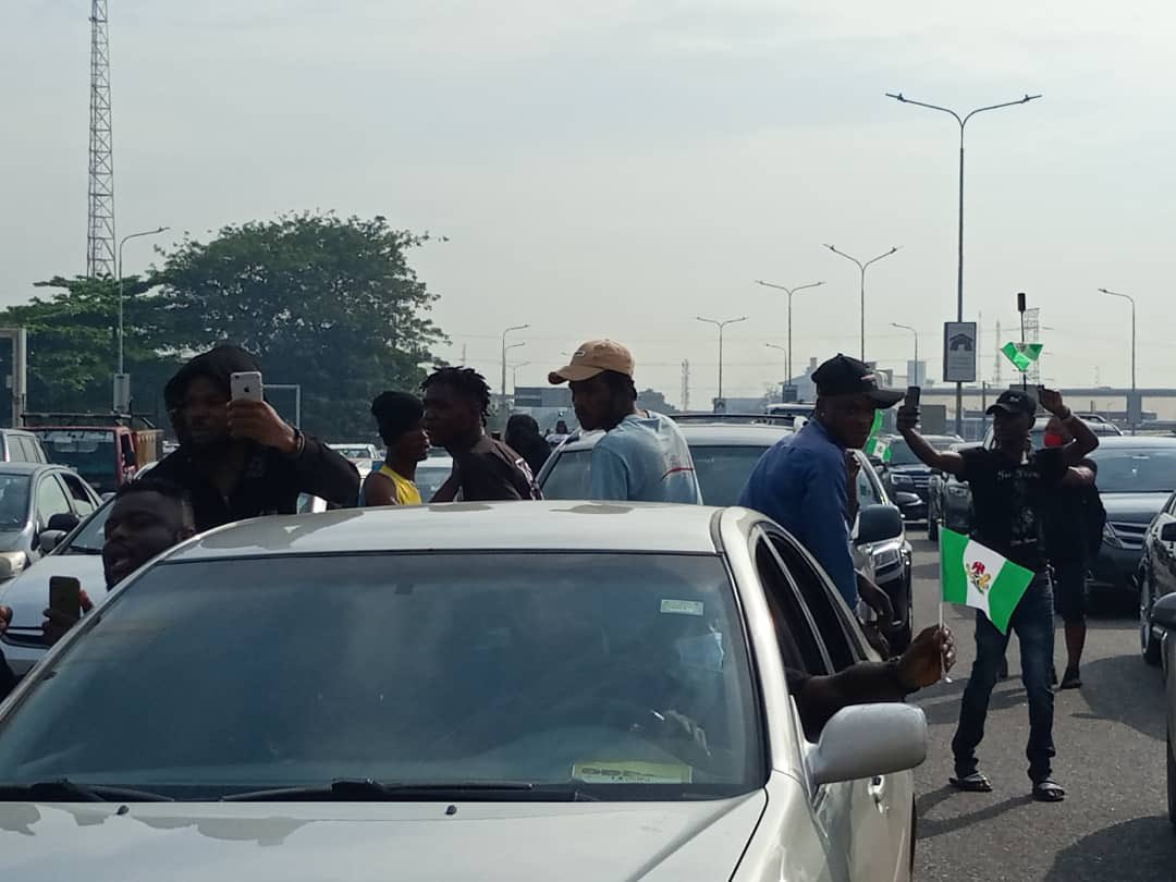 EiENigeria's tweet photo. The momentum is building at Lekki toll gate, venue of the #EndSARSMemorial on the Island despite heavy police presence! Join us! 
#EndSARS https://t.co/YxbrX8LYUz