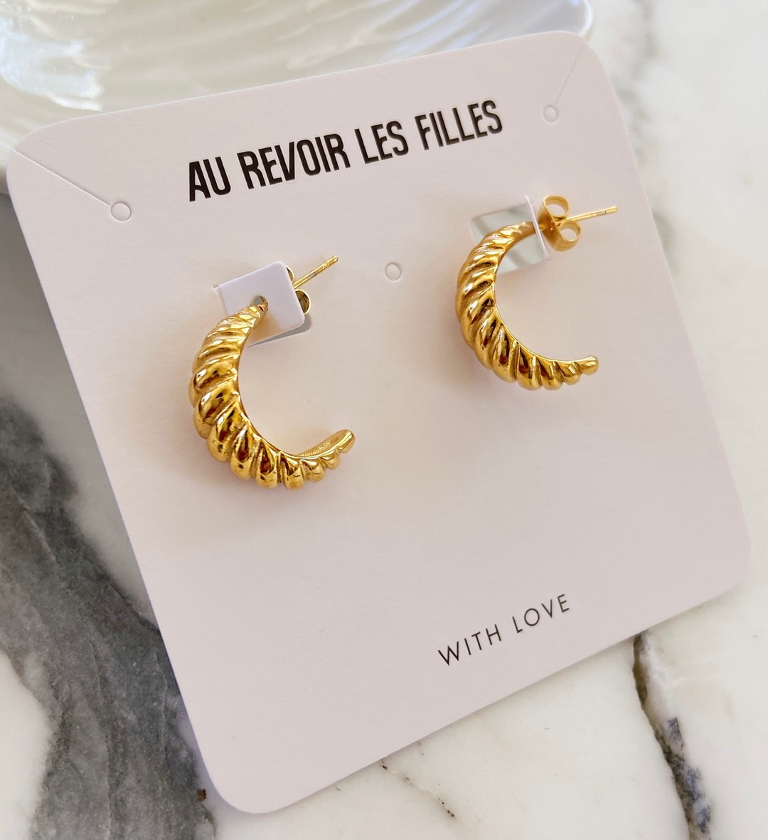 AUREVOIRLF's tweet photo. Chunky gold hoops inspired by your favourite French Pastry! 🇫🇷🥐 Our new arrivals add a touch of sophistication to any outfit, as simple as a classic white shirt and jeans 😍

Want to win $75 to spend at #aurevoirlesfilles? 
Comment below what kind of earring style you https://t.co/fjK0SJja61