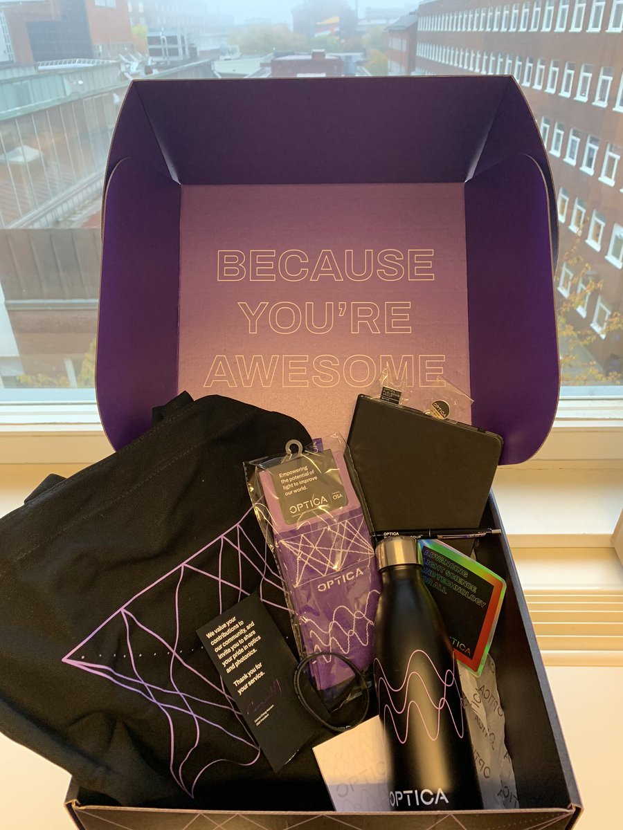 No, <a href="/OpticaWorldwide/">Optica</a>, YOU and all your wonderful staff and volunteers are awesome! 💜 Thank you for the great surprise which brightened my first (rainy) day back in office after the longest time!
P.S. How on earth did you know I needed new socks?? Love them!!