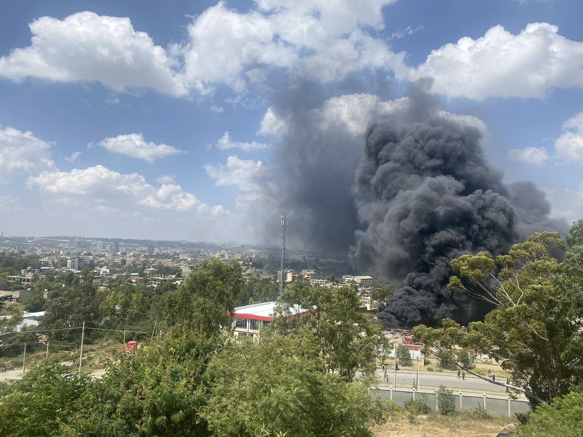 ProfKindeya's tweet photo. The jet dropped bombs in the middle of the town near #Mekelle #Hospital. Many are wounded &amp; casualties are being assessed. People are fighting to extinguish the fire. It is still blazing #TigrayGenocide - desperate move by @AbiyAhmedAli https://t.co/URadDdFNb2