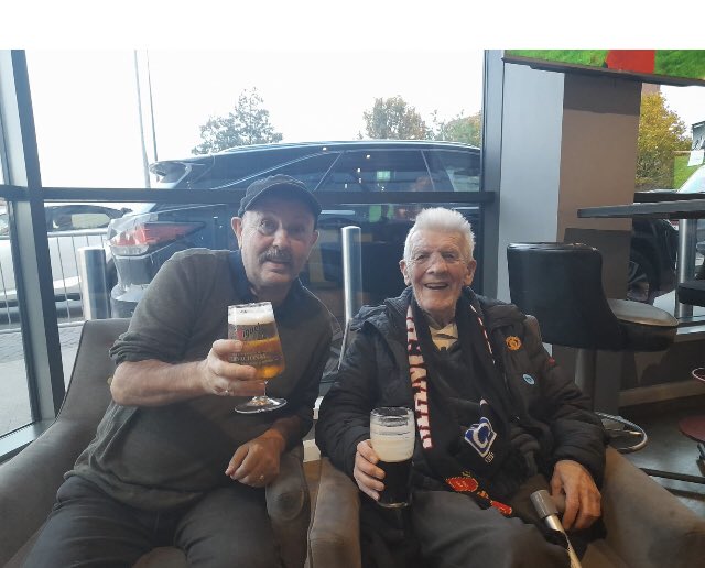 ‘Old’ John has arrived at OT (82 yrs since his 1st visit) &amp; he’s so pleased to bump into <a href="/AlexStepney1/">Alex Stepney</a> 
Next stop <a href="/hotelfootballuk/">Hotel Football</a>