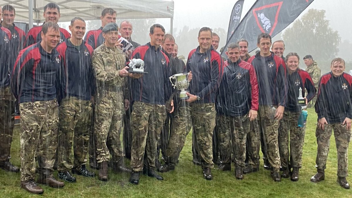 1UKDivision's tweet photo. The winners of The Bismarck Challenge 2021 are the Light Dragoons !!

They received the trophy from the GOC in a torrential downpour!!

Well done to all that took part and all the other trophy winners.

See you in 2022!!

#teamrhino🦏💪#people https://t.co/Uy94uqu0x6