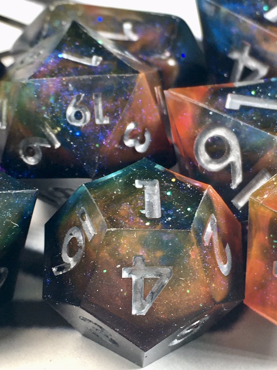 LetoAnimas's tweet photo. B.Y.R1 Galaxy dice set! Only one of the two sets poured really turned out great, so here’s pics of that one! #dice #handmadedice #dnd #nerd #galaxy #sharpedge #resin #resinart #shinies https://t.co/g0uuHwn5w2