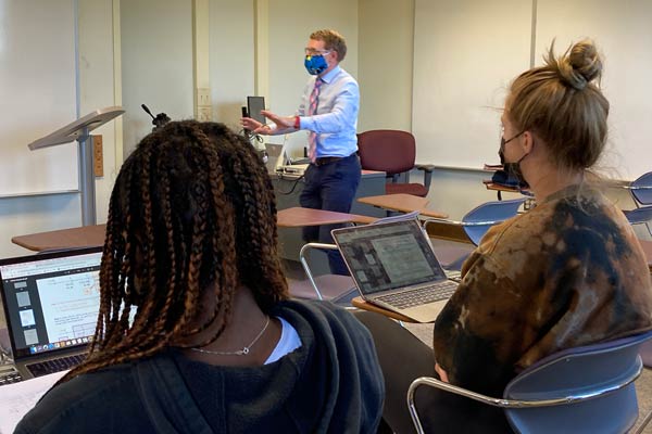 Nazuniversity's tweet photo. "You can tell he cares about us," marketing major Sarah Flynn '22 said of finance Prof. Chauncey Joyce, at Corporate Finance class. "If we're frustrated and having trouble, he'll go back. He wants us to know how to do it right." #openclassroomweek https://t.co/FN0Hx7VkuT