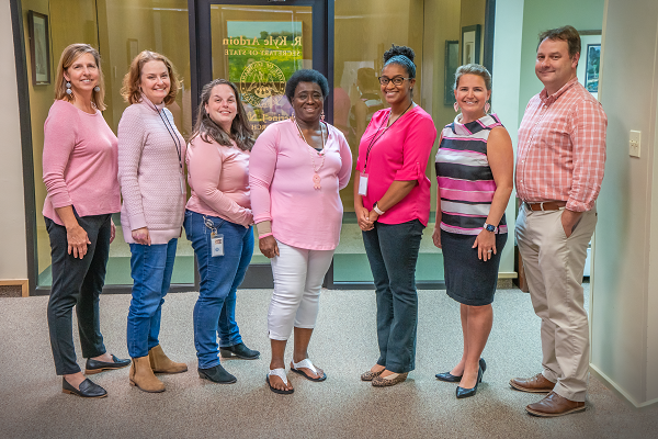 Louisiana_sos's tweet photo. In honor of Breast Cancer Awareness Month, #LouisianaStateArchives Staff wore pink today for colleague Charlean Daniels (middle), a two time breast cancer survivor. Charlean has worked for our office for over 31 years. Who do you wear pink for? #PinkForADay #BreastCancerAwareness https://t.co/PkdZXLT7cp