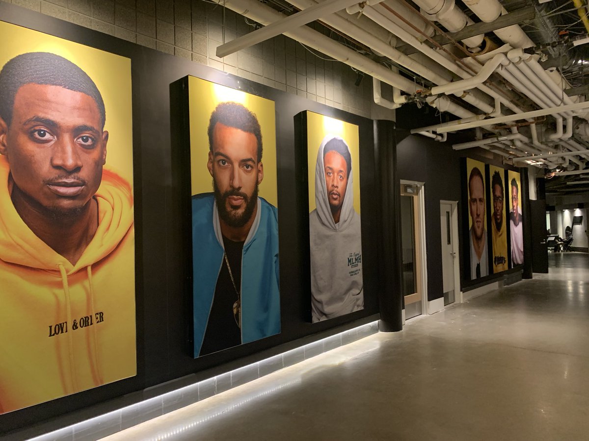 tribjazz's tweet photo. New player photos adorning the walkway on the event level of Vivint Arena. https://t.co/OC2L6pLPR5