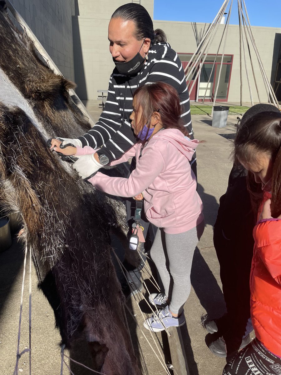 stfrancisyeg's tweet photo. The scraping of the moose hide continues…#landbasedteaching https://t.co/GLloqyAy69