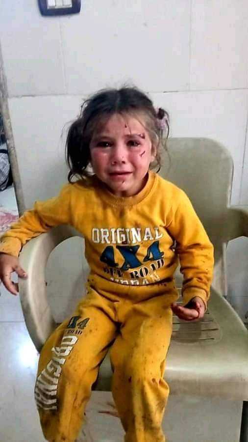 Zahra est une petite fille de cinq ans. Elle a été l'une des victimes du massacre d'Ariha, elle a été blessée alors qu'elle était avec son père et son cousin au marché. Zahra a survécu, mais son père a été tué, tandis que son cousin a été grièvement blessé.