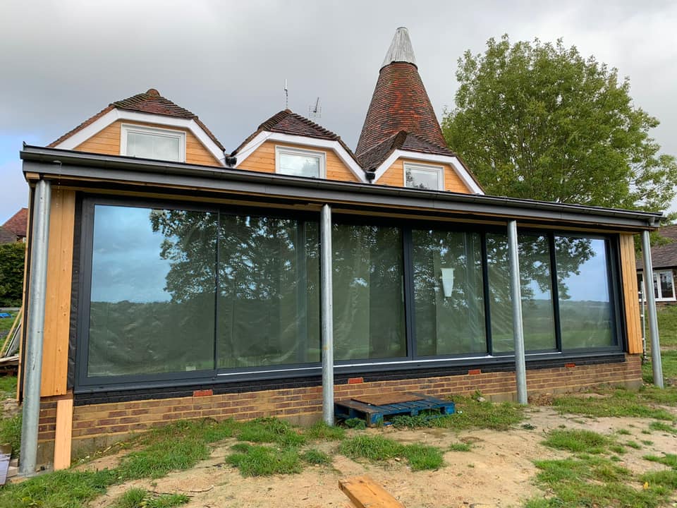 VernacularHomes's tweet photo. We are so pleased to see the The @IDSystems_UK 9m #slidingdoor set now installed at our #TunbridgeWells site. The cut through from the existing #Oast to the extension is also now complete and you can see the new #internalwalls that have started to go up. Check out the progress 👇 https://t.co/CRdwZ1l95h
