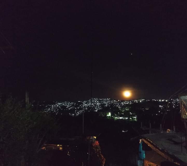 mizozeitgeist's tweet photo. The carpet of lights and 'nearly fullmoon' over #Zemabawk area of #Aizawl city create an eerie scene at night. A sky above. A sky below. #Mizoram https://t.co/Ss9DUQVY7V