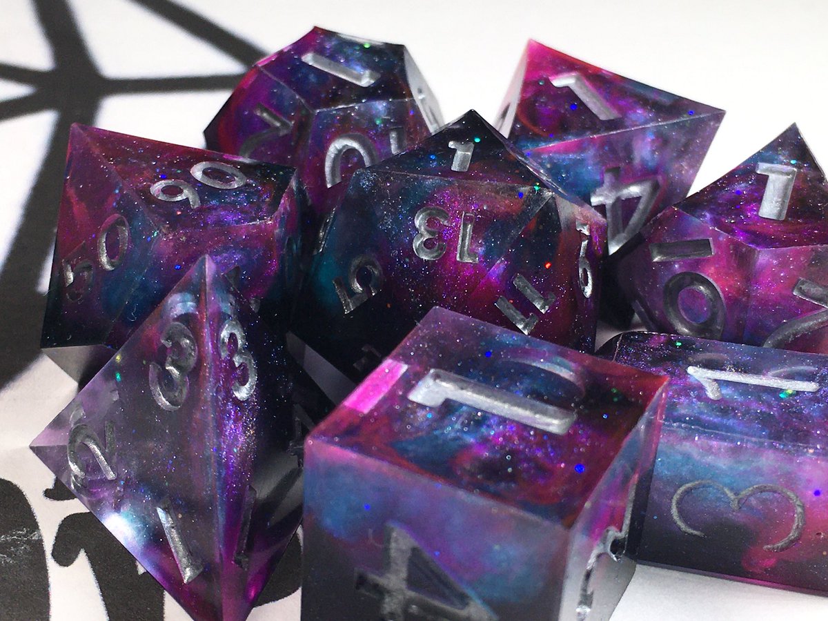 LetoAnimas's tweet photo. Here’s my final (for now) version of the galaxy dice! I think I’ve nailed this style. #dice #galaxy #handmadedice #dnd #sharpedge #resinart https://t.co/pN7UNpPkoT