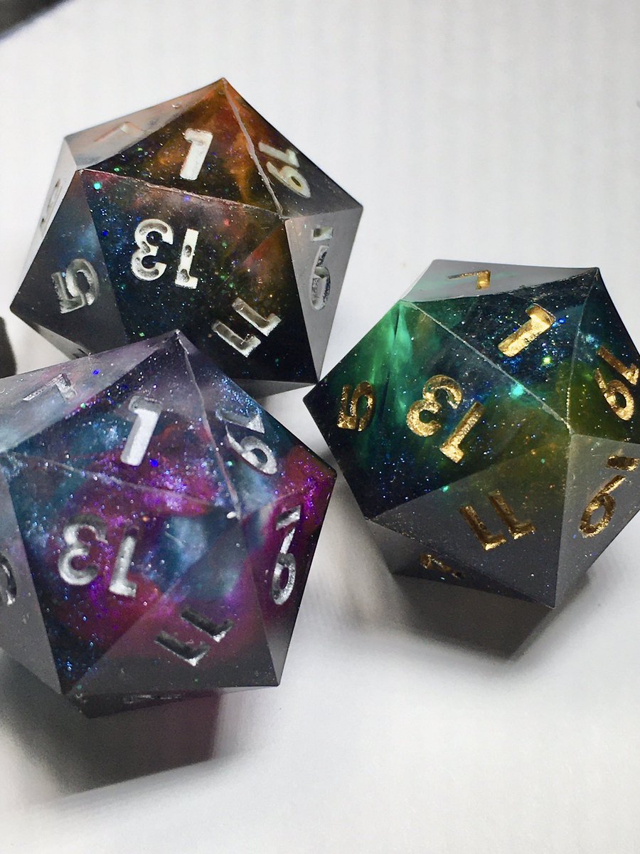 LetoAnimas's tweet photo. Here’s my final (for now) version of the galaxy dice! I think I’ve nailed this style. #dice #galaxy #handmadedice #dnd #sharpedge #resinart https://t.co/pN7UNpPkoT