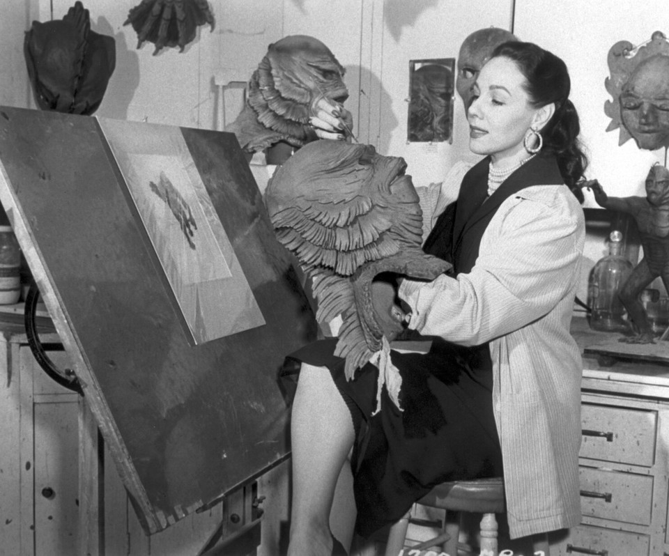 Milicent Patrick poses in the Universal Studios monster shop with her most famous creation: the Creature from the Black Lagoon.