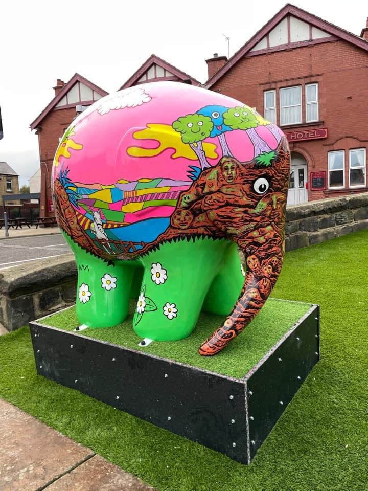 VisitCudworth's tweet photo. Great photo of the Elmer Cudworth themed elephant in the new public area St. John’s Garden just down from the Star Hotel by Jo Cuthbertson. This project was by Barnsley Museums and the amazing artist @lewisryanart. Look forward to seeing you’re photos too #cudworthiscool https://t.co/n4HtjQlNQv