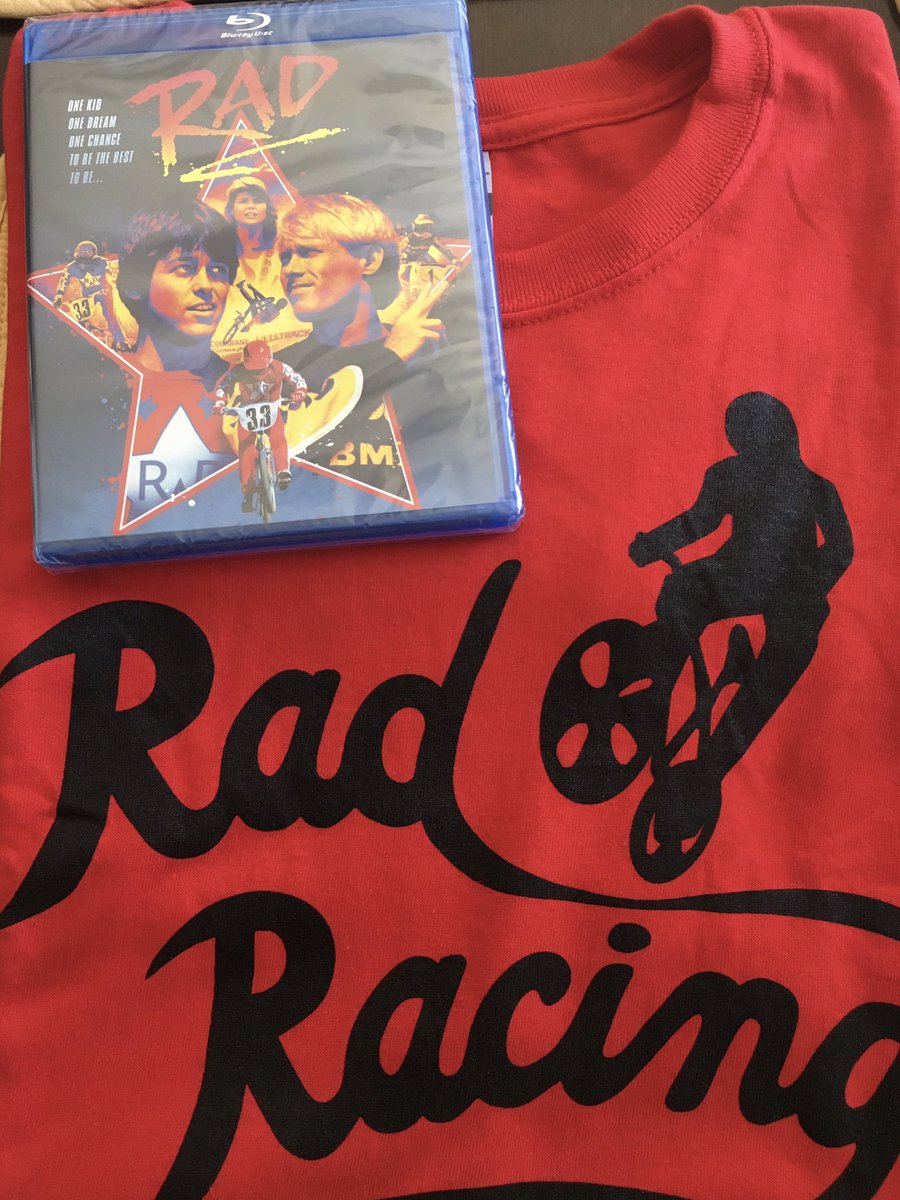 Knobby_Ballads's tweet photo. For #tbt from 10/14 35th Anniversary of Rad (The Movie). Rad in blu ray and Rad Racing Tee shirt! Went to a theater for the remastered 35th Edition. Stoked to see blu ray. #rad #radracing #crujones #cru #helltrack #breaktheice #thunderinyourheart #80s #bmx #bmxracing #80sbmx https://t.co/qiRJ7wTXrX