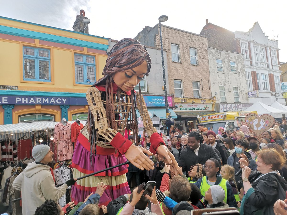 Little Amal is an incredible 3.5m tall puppet representing millions of children forced from their homes. She just walked through #Deptford with a samba band behind her &amp; a huge crowd to meet her.

Very impressive creativity from <a href="/GoodChanceCal/">Good Chance</a> to raise awareness

#RefugeesWelcome