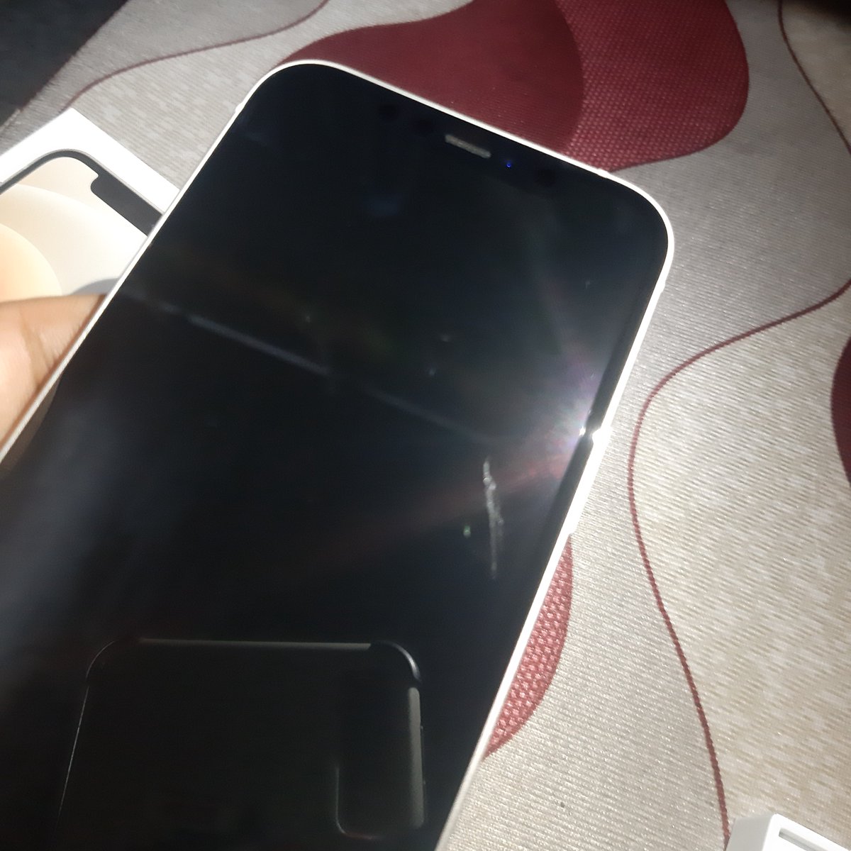 rohit_sutti's tweet photo. I ordered a i phone 12 from flipkart and received it with a scratch on screen. i tried to approch customer care also but i don't get the proper response. They are just giving me the consecutives dates but my problem is still not solved. 
@Flipkart  @flipkartsupport https://t.co/bciIS5eWp3