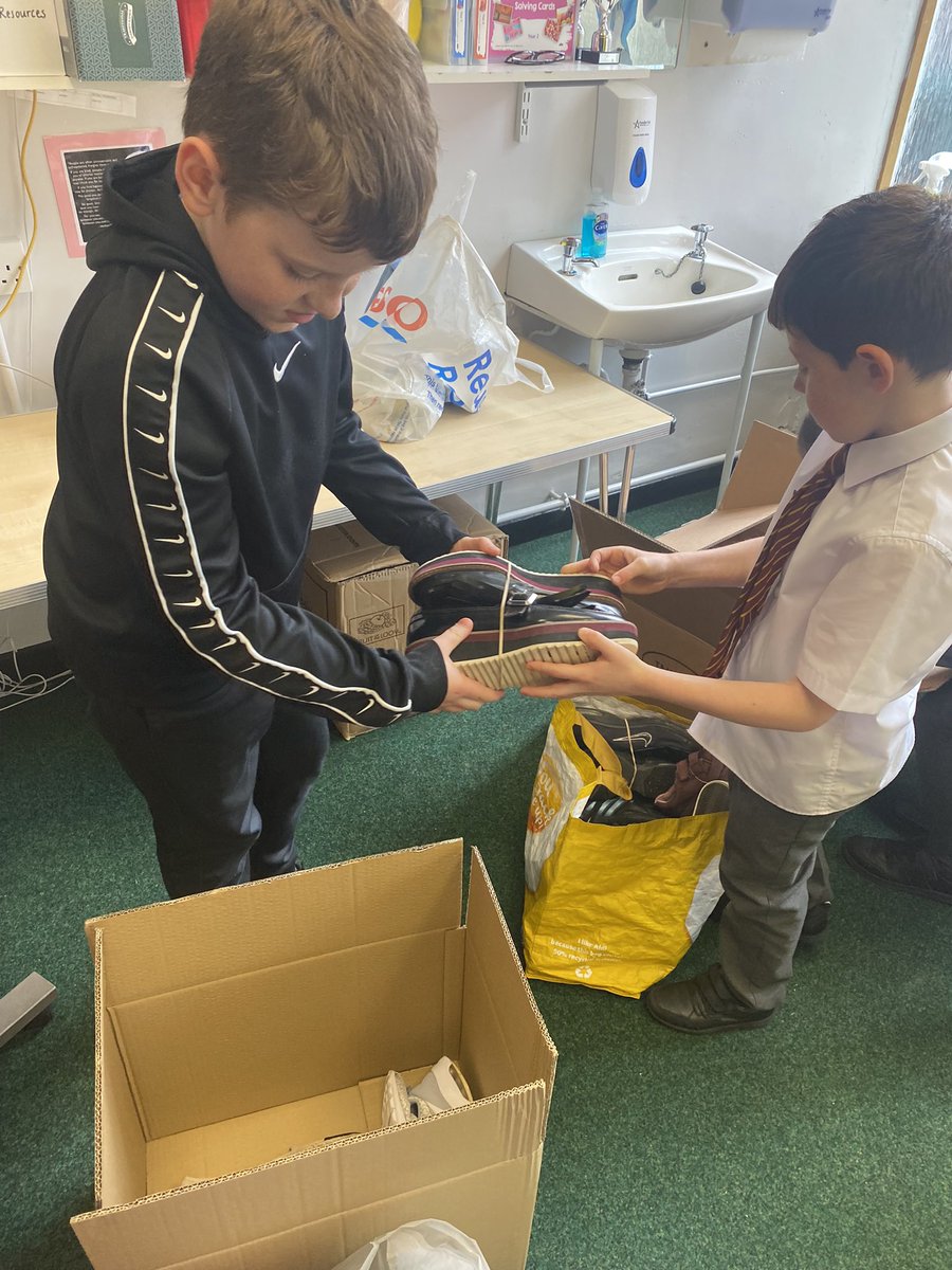 HolyCrossNLC's tweet photo. Some Laudato Si work in action today with our Rights Respecting Group taking action for a global cause. Thank you to our school community for helping us. #globalgoals #Shoeshare @UNICEF_uk @Pontifex @LaudatoSiMvmt @rercag https://t.co/i59qlQ0efF