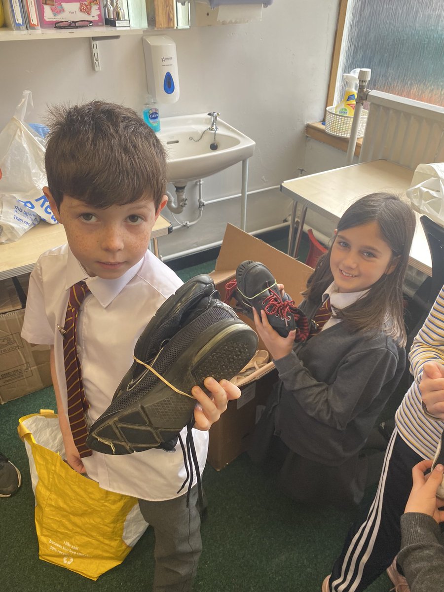 HolyCrossNLC's tweet photo. Some Laudato Si work in action today with our Rights Respecting Group taking action for a global cause. Thank you to our school community for helping us. #globalgoals #Shoeshare @UNICEF_uk @Pontifex @LaudatoSiMvmt @rercag https://t.co/i59qlQ0efF