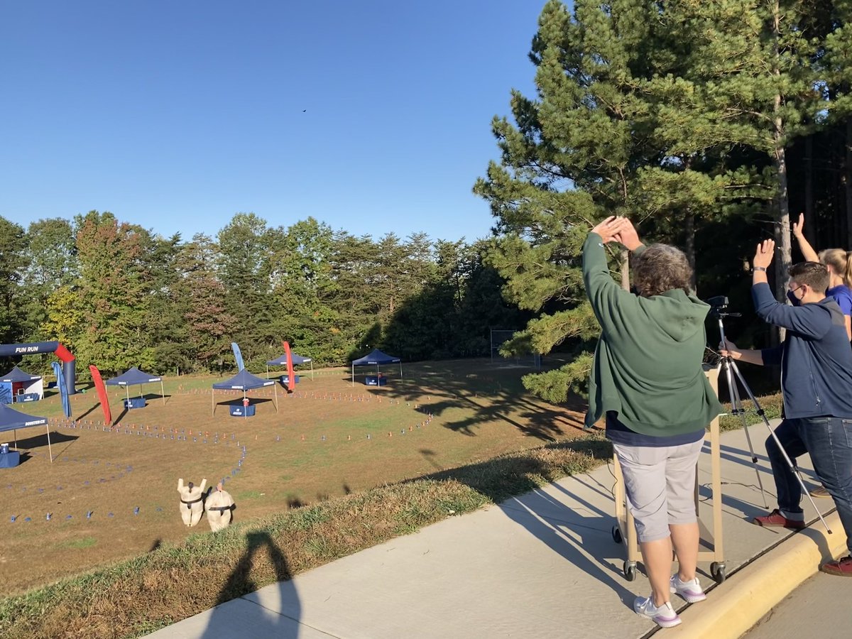 CounselorHanger's tweet photo. It’s Fun Run Friday! SPES Nest News broadcasting the morning announcements in the Fun Run field. Yep, those are our admins getting the fun started in their sumo suits.  @SPES_Eagles https://t.co/qiWcbEMz7w