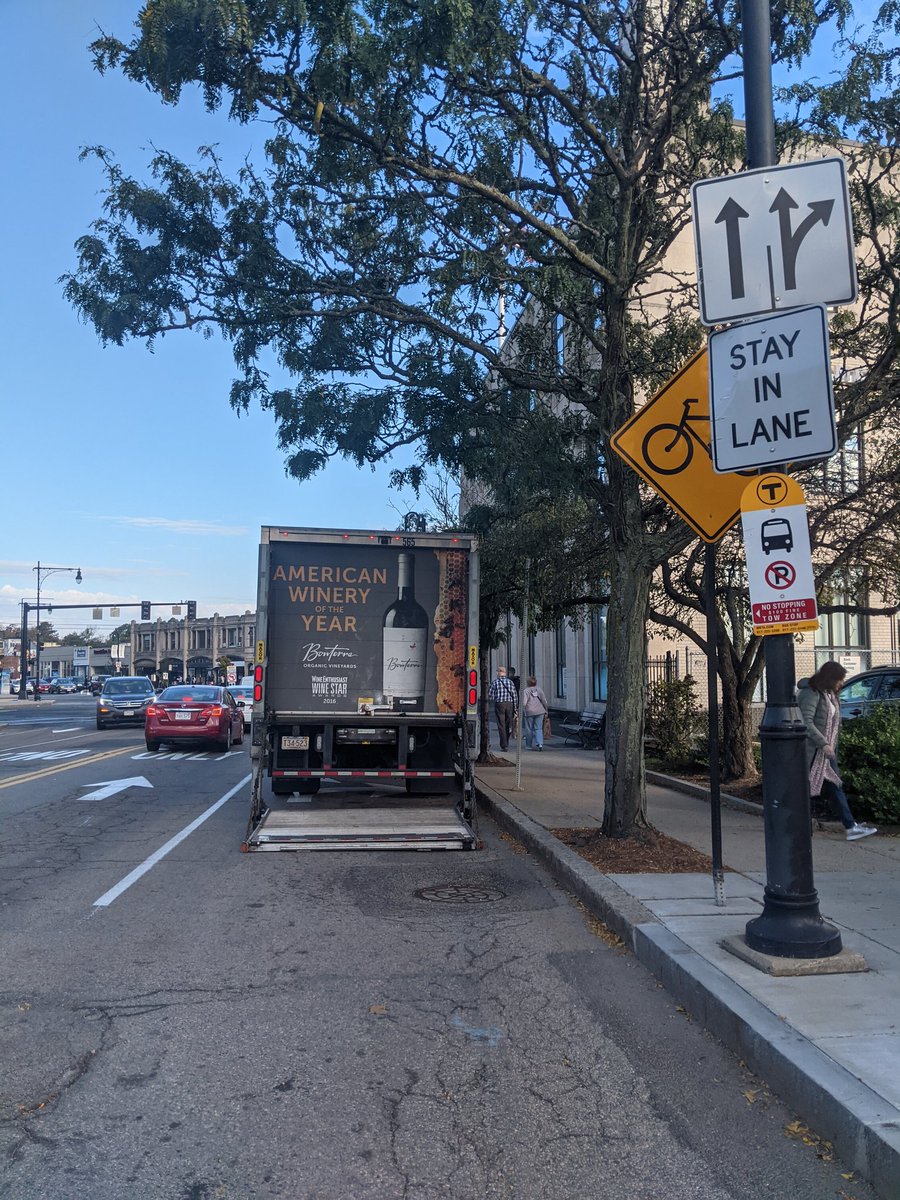 FigCop's tweet image. I spy with my little eye two illegally parked behemoths in #CoolidgeCorner #Brookline. @BrooklineMAPD how much is the fine for parking in a bus stop, parking in a bike lane, parking in a car lane, blocking view of a pedestrian crossing? @BlineTransport