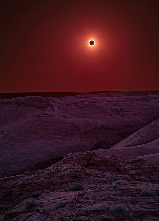 Solar eclipse over canyon de Chelly , looks like a black hole from another world