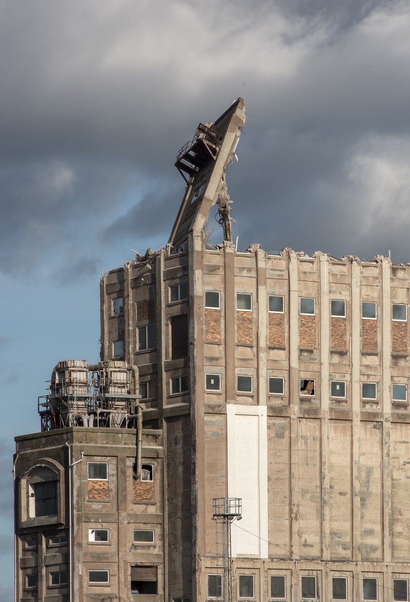 AlbieClark's tweet photo. Imperial Dock Grain Elevator, Leith. Sad to see the corner finally come down, and a fair old spot of luck with a sprint to capture it/30 frames left on the card. #leithdocks https://t.co/aVyqT06436