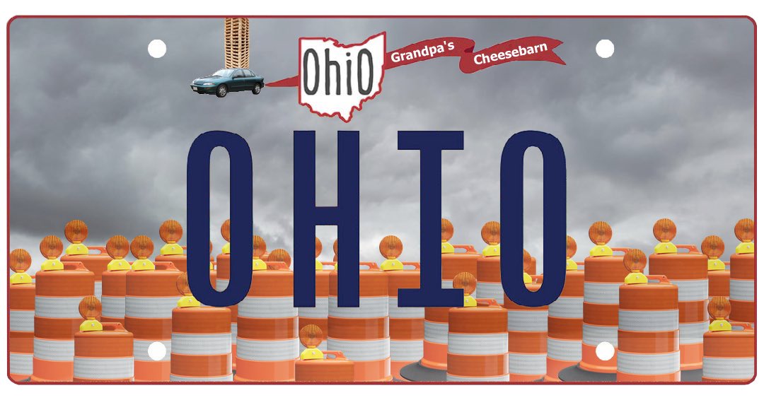 Morgan_Hughes's tweet image. I updated the new Ohio plate to more accurately reflect what our state is all about. Construction barrels, an endlessly cloudy gray winter sky, and a 1997 Chevy Cavalier with pallets stacked on the roof.