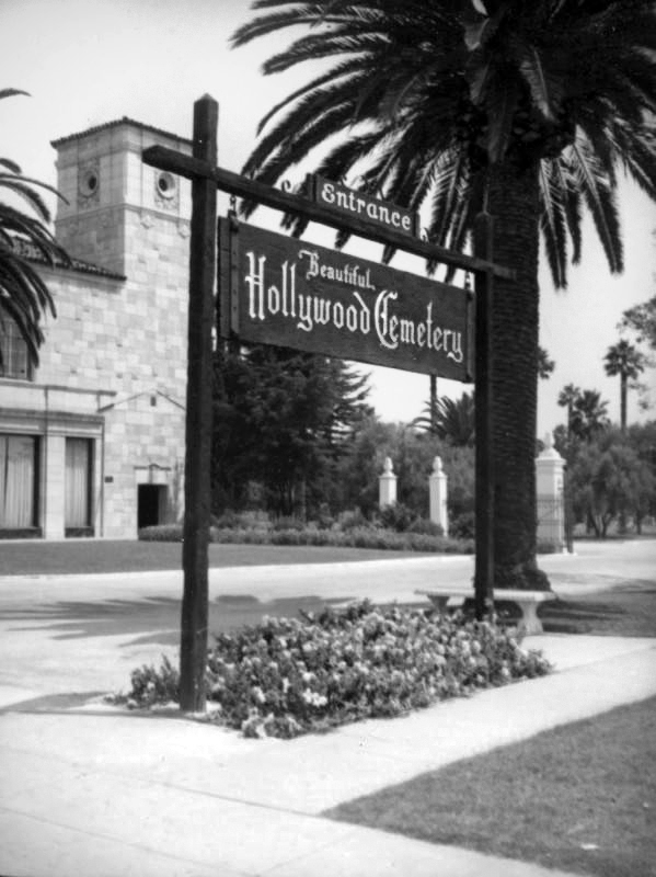 laplphotos's tweet photo. [ca.1938] The administration building is behind the wooden sign for the "Beautiful Hollywood Cemetery" next to the entrance. (Herman J Schultheis Collection) https://t.co/q5wfaDFt9i https://t.co/zzAsmEJ6Mc
