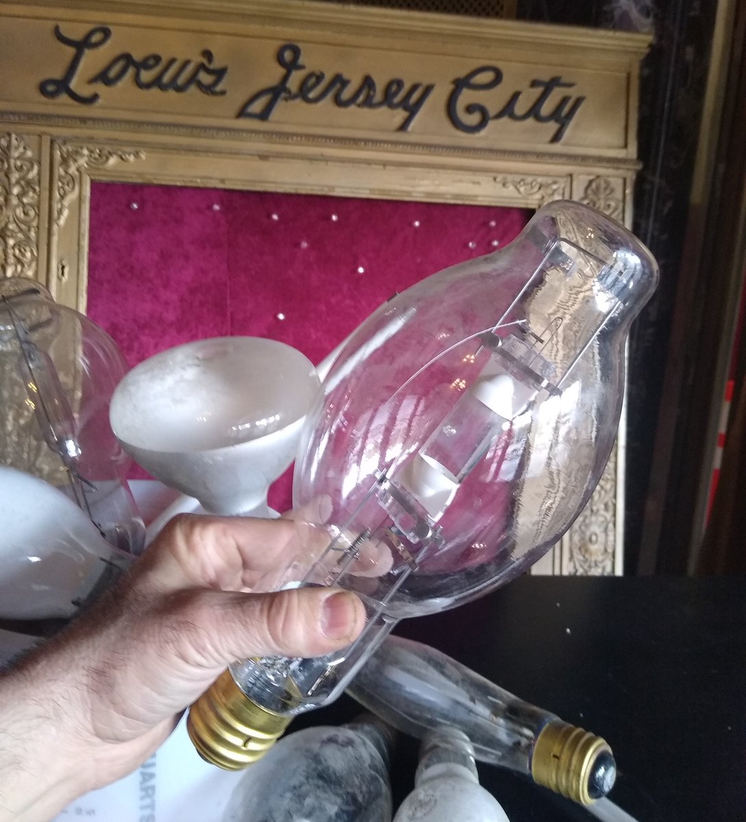 Here's a BRIGHT idea - give some time this Sat &amp; Sun, Noon to 8pm helping #FOL pack &amp; purge as we continue to get out of the way of the #LoewsJersey 's big renovation &amp; restoration. You never know what we'll find when we move a box: in this case, a wild assortment of old bulbs.