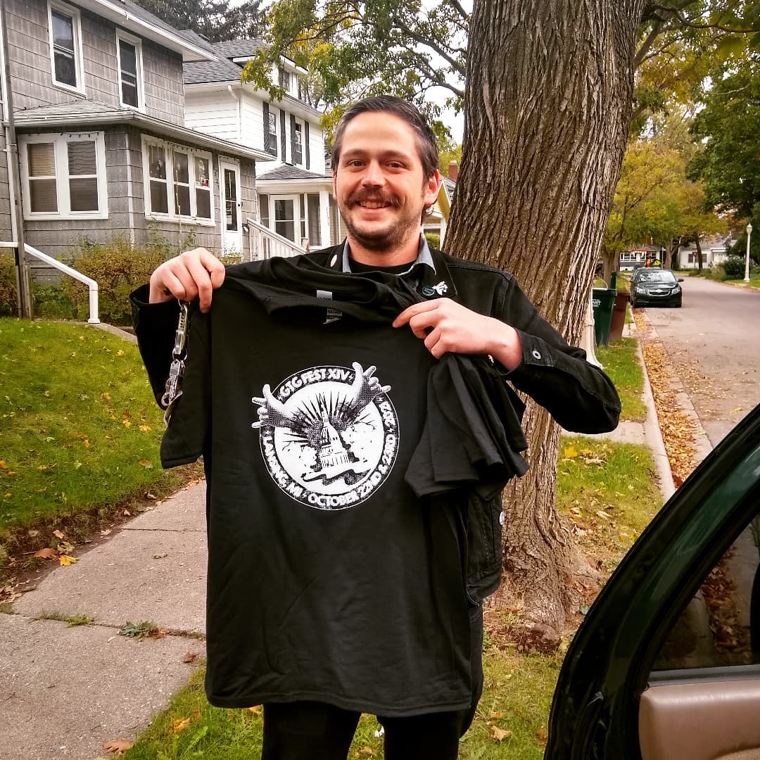 This could be you! Not the shell of a man that was Nich, but the happy holder (and presumably wearer) of a #gtgfestxiv shirt! 8 PM at Avenue 10/22!! #gtgfest2021 #gtgfest #lansing #michiganmusic <a href="/therecordlounge/">The Record Lounge</a> <a href="/REOTown/">REO Town</a> <a href="/hellyeah_avenue/">Avenue Cafe</a>