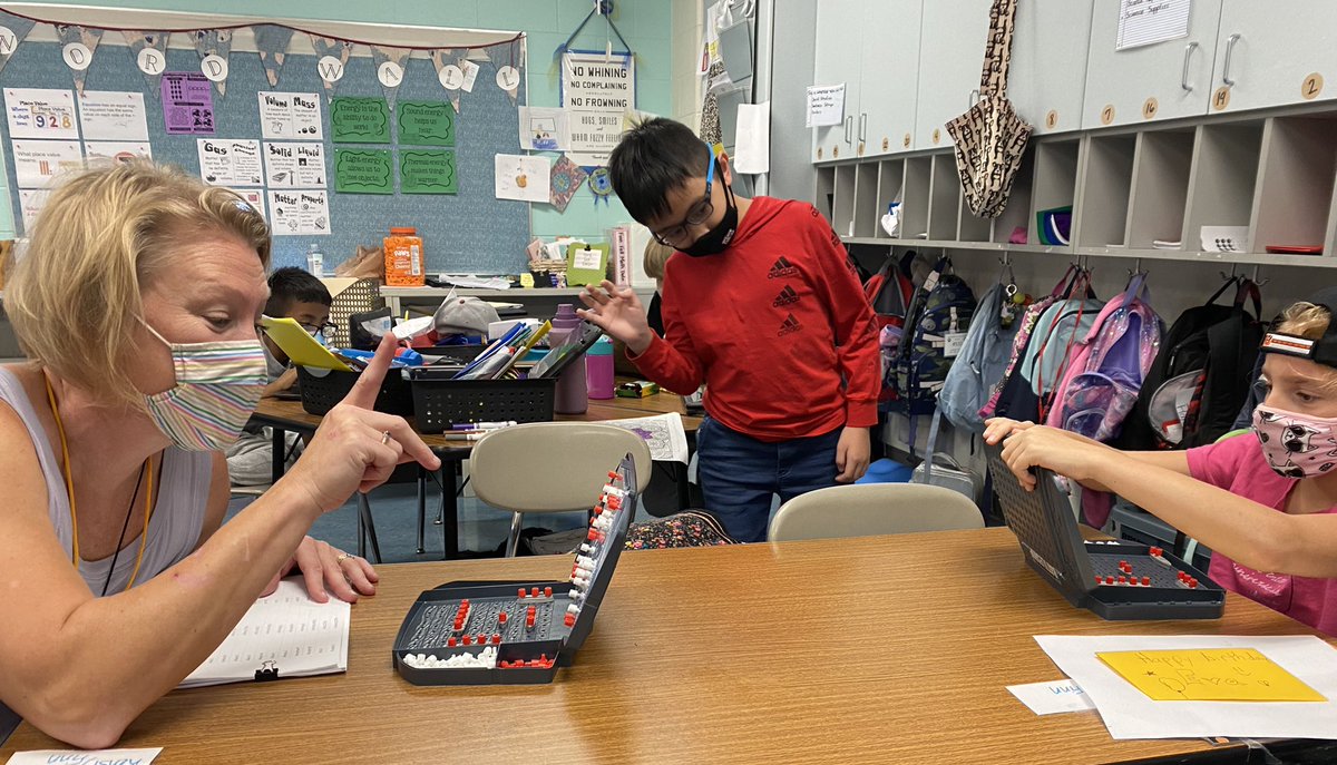 Very competitive teacher surrendered her battleships to a fair and gracious winner. Math fun in the form of a game. (She beat me by one call-OMG!)