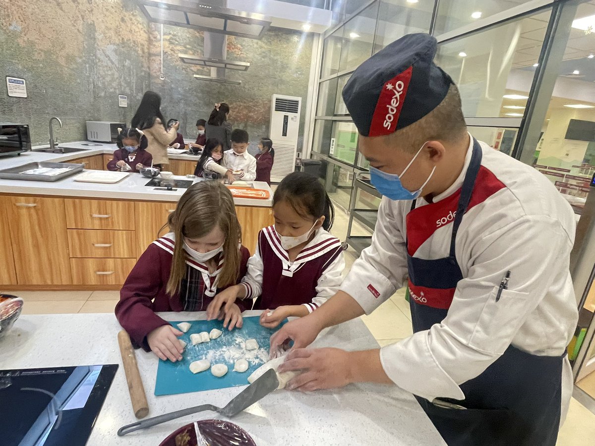 MsAshleyHeath's tweet photo. G1 students @CISBeijing putting their #instructionalwriting in action as they make dumplings in the #demokitchen! #ibpyp #handson #deliciouslearning https://t.co/lC5SGD8YX7