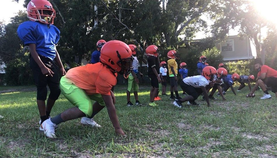 UMNS's tweet photo. One night last year, the Rev. John Legg noticed youth playing football on the open athletic field behind Temple Terrace #UMC. Legg later said, “We’ve been asking God to send us children. Well, 250 of them just showed up on our doorstep.” @FLUMC reports. https://t.co/ivDYNxXlZx https://t.co/wmqPROA1qu