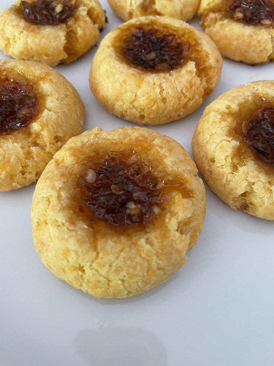 NordicFoodGeek's tweet photo. New favorite cookie ever! Cheesy thumbprints with pepper jelly. These will be lovely on holiday platters and perfect for Halloween snacking. The problem is making enough to outlast my eating them hot out of the oven! #dangerouslydelicious https://t.co/HL7ElVJsRy