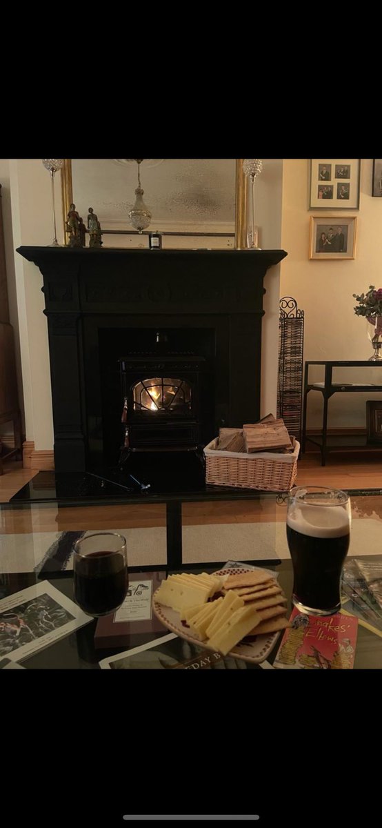 Pint of Beamish with crackers and cheese and a fire 🔥 you can’t bate it #Beamish #CheeseandCrackers