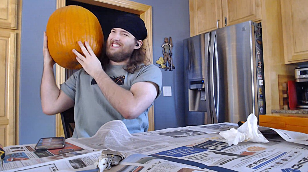 verracaravan's tweet photo. Vaknar, @AshesofCreation Community Moderator/Staff Member during a Discord Livestream. Vaknar was brave enough to carve a large pumpkin despite some rusty carving skills. Have you ever carved more than a triangular face? #AshesofCreation #IntrepidLife https://t.co/lTPvgkxt5e https://t.co/AGJyN3mfO5