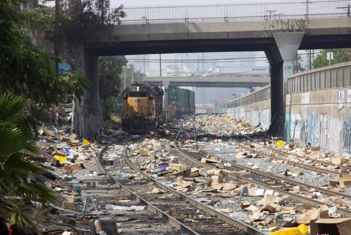 Meantime…this is modern day train robbery. Modern day LA not far from Union Station…a few days ago. Unfortunately it is happening every day. As soon as the train stops, thieves start opening containers. It is quite well organized. This is the main line.