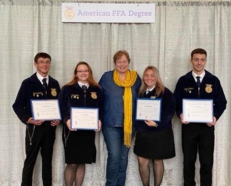 Trinity FFA added three additional American Degree recipients. Congratulations to all and the families involved! 
From left to right Joshua Conkle, Erica Miller, Mrs. Durila, Ashley Burbank (2020), Dalton Rogers
<a href="/LucasOilStadium/">Lucas Oil Stadium</a>
<a href="/TRINITY_MLUCAS/">Dr. Michael Lucas</a> <a href="/DonSnoke/">Don Snoke</a> <a href="/thstrinitypride/">Trinity High School</a>