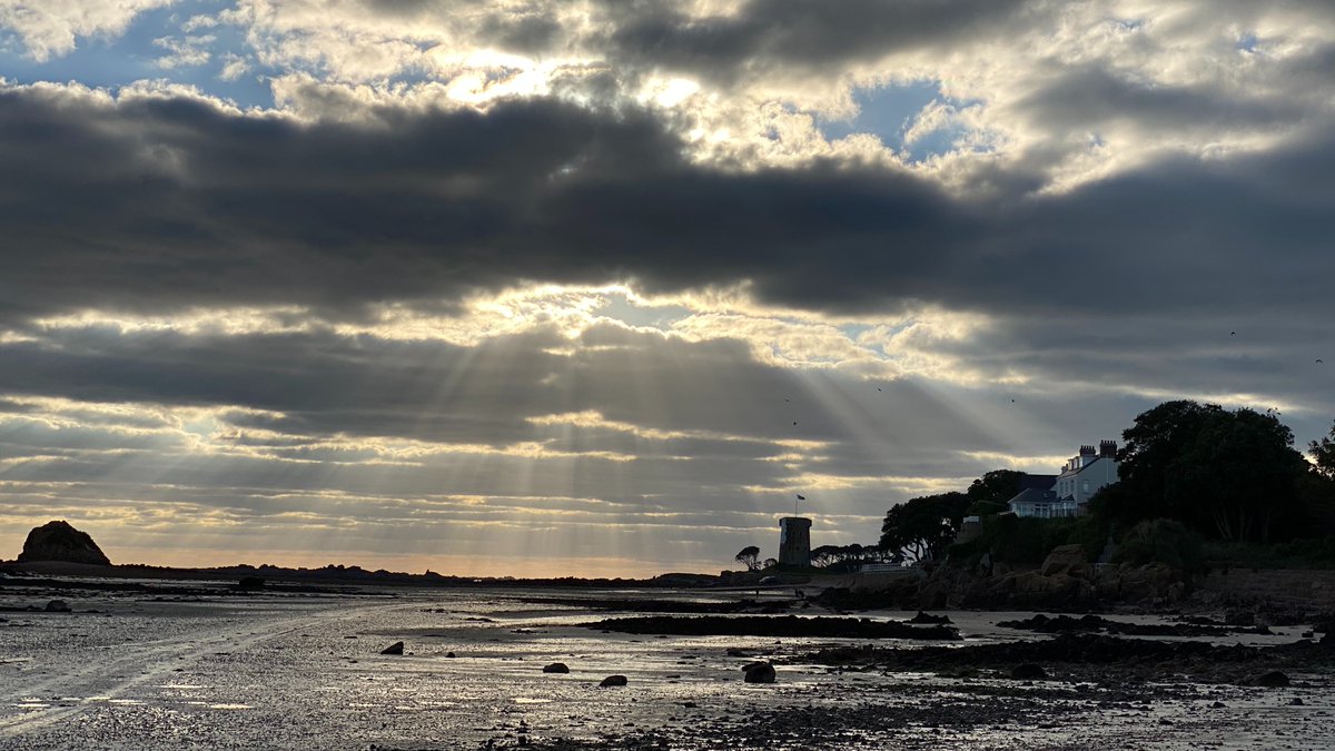GwynGB's tweet photo. Walkies on the beach this afternoon - Harrison Lane is going to love Jersey and the dramatic scenery. Hope you've all had a good day. #MermaidRock https://t.co/uF18icEJuw