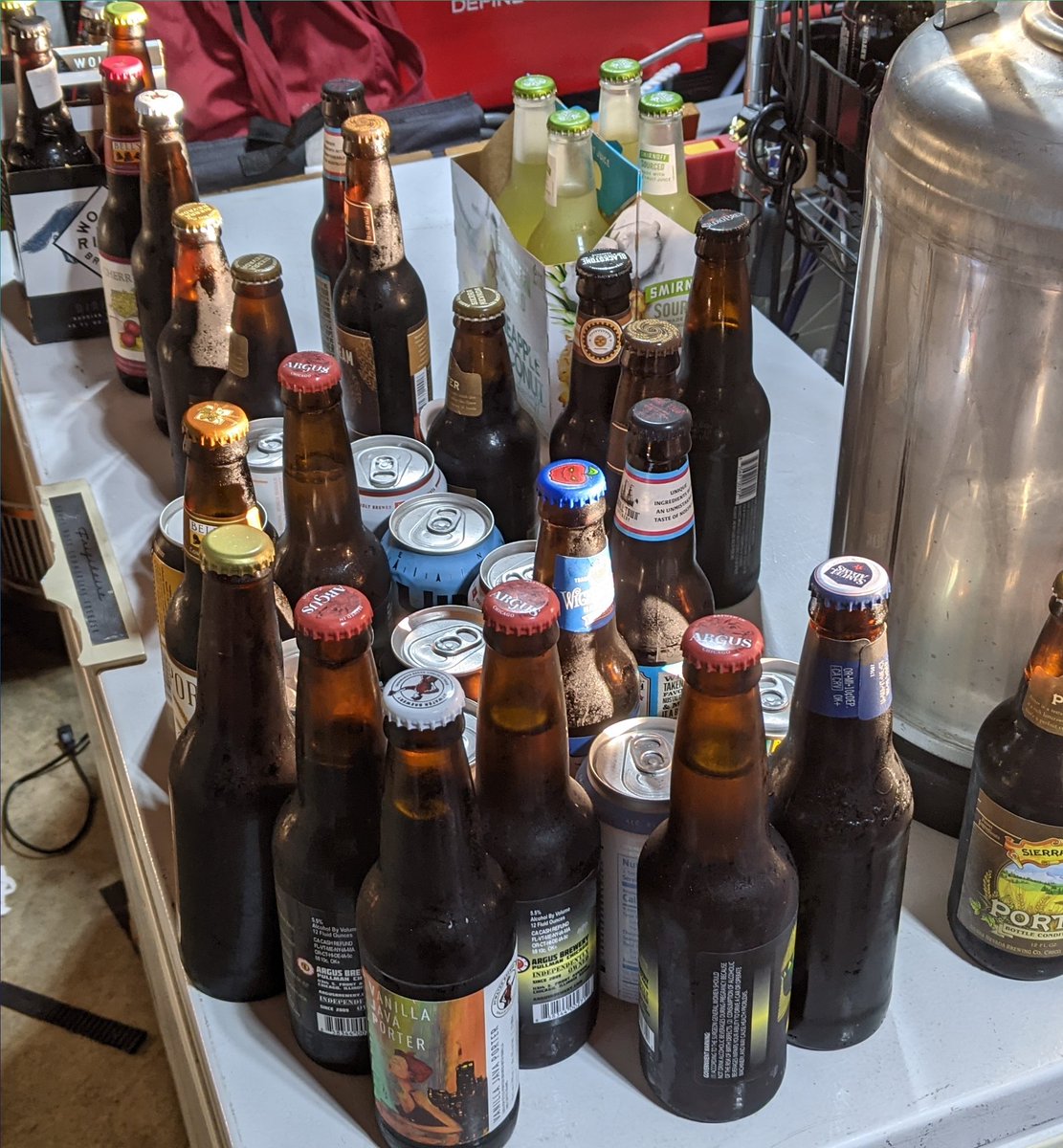 What do you do with extras from a beer competition and some old beer &amp; cider from the beer fridge?

Put it in a fermenter. Then put fermenter in a freezer and freeze distill it to create a concentrated beer for your first wash of course!!