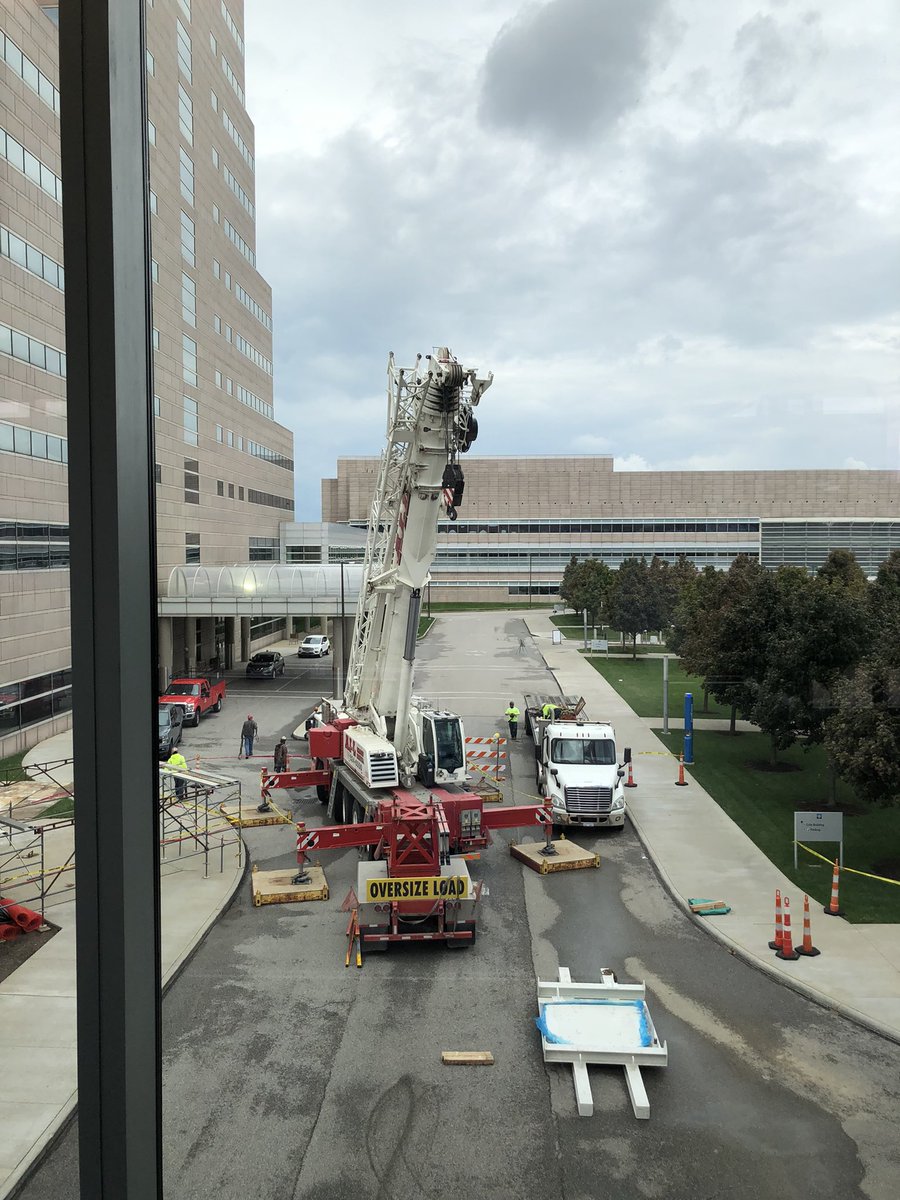 ErinMurphyMD's tweet photo. Exciting times: #ASTRO21 has started with a focus on patient centered #radonc care AND we have a crane outside #clecliniccancer loading in our second #gammaknife machine. Expanding the utility of CNS  #radiosurgery to even more patients @DrJohnSuh @SamuelChaoMD @GeneCollector https://t.co/ek6GlizAAq