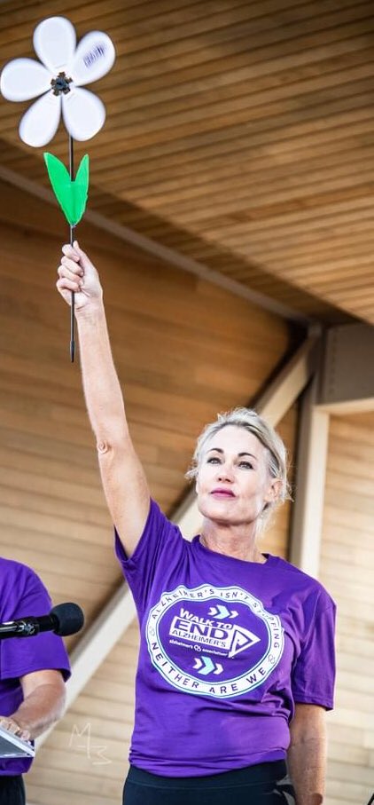 MikeMorganKFOR's tweet photo. A #COVID19 #OkieERNurse 35 year veteran lifetime of service #Nurse holding up high the hope of the first white flower in the garden. Scissortail Park #OKC #Oklahoma #Walk2endALZ #ALZwalk Humbled by #MIOMarla 10.23.21 https://t.co/fVN7nev1jr