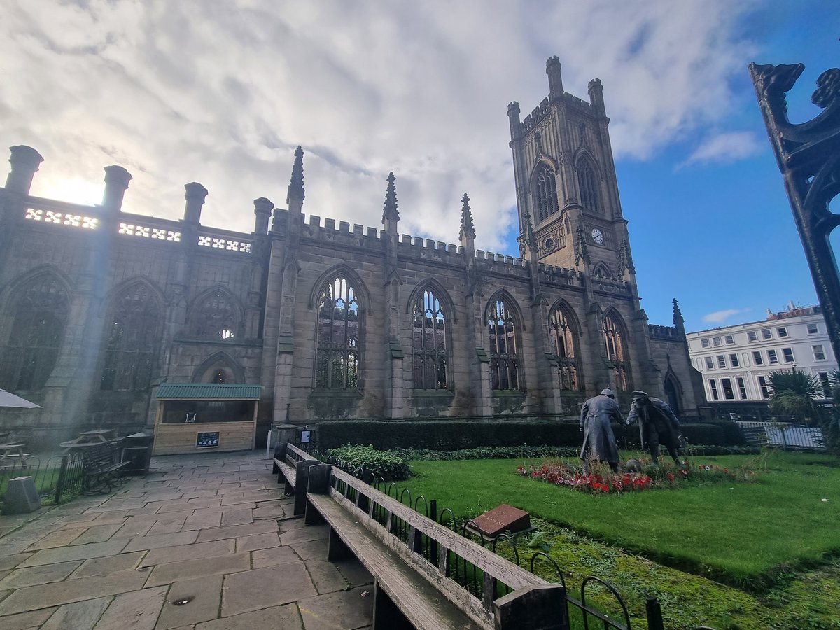 Class12stmarys's tweet photo. Visiting Liverpool today I saw St Lukes bombed out church. Bombed in WWII it has no roof or windows but stonework remains. The statue commemorates a football match that is said to have taken place during a Christmas truce in the trenches of WW1. @stmarysderby  #Alwayslearning https://t.co/SFaCJ9gLL0