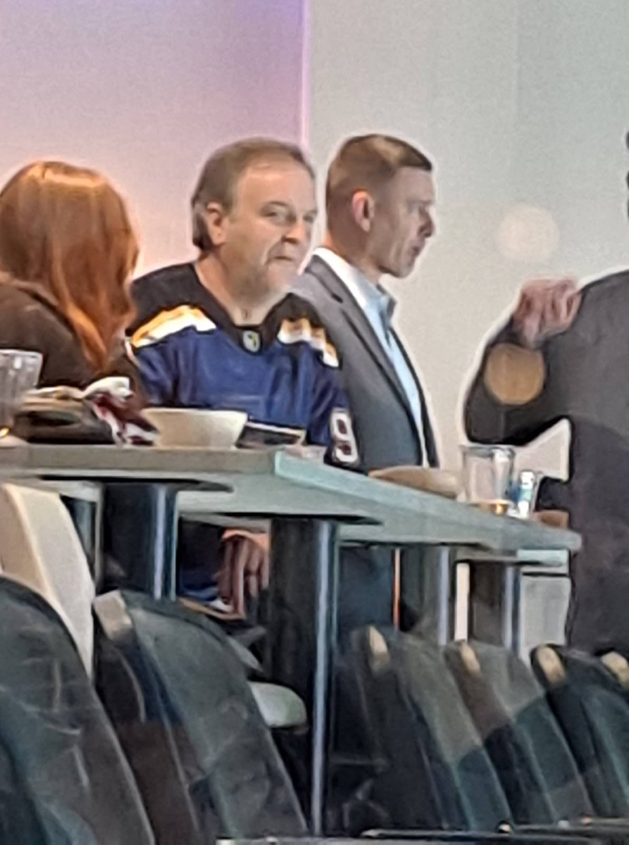 ChiefTimFitch's tweet photo. County Executive enjoying special access in the owner's box at the Blues game last night.  
Enterprise rules:  "Face coverings must be worn by all fans over the age of five."
City of St. Louis indoor mask mandate in effect.
#RulesForTheeNotForMe https://t.co/Ag4Mcszokm