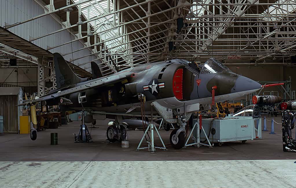 HarrierPres's tweet photo. Circa 1975, some shots of AV-8A production, looking at the hangar, I’d say this is Dunsfold, note the twin MATRA rocket pods, on the inner pylon, and the tall tail of a TAV-8A on the second image. #AV8A #HarrierGR1 #HawkerSiddeley https://t.co/SAAI2lJMgp